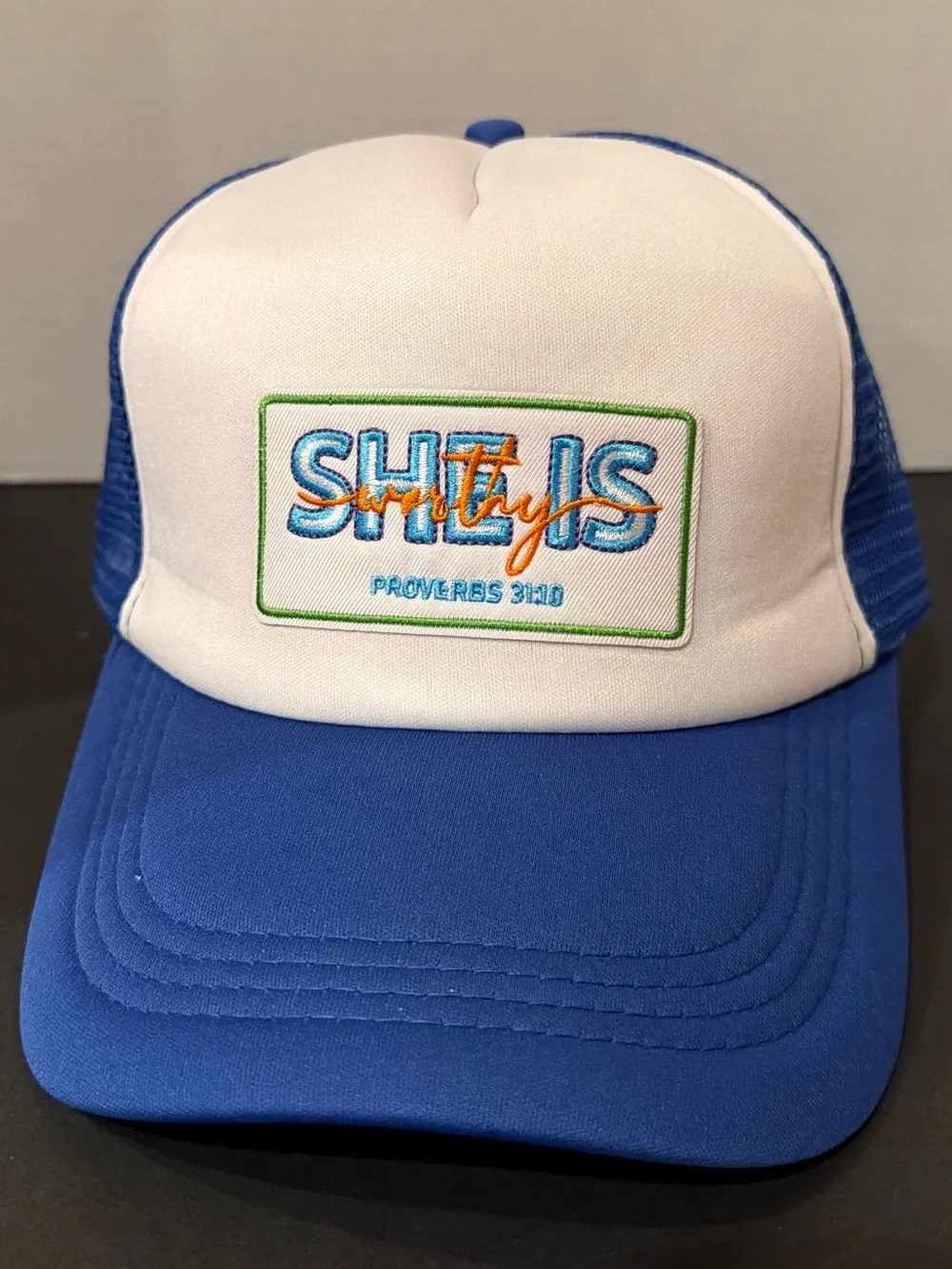 Blue and White Trucker Hat with Embroidered Logo “she is worthy”